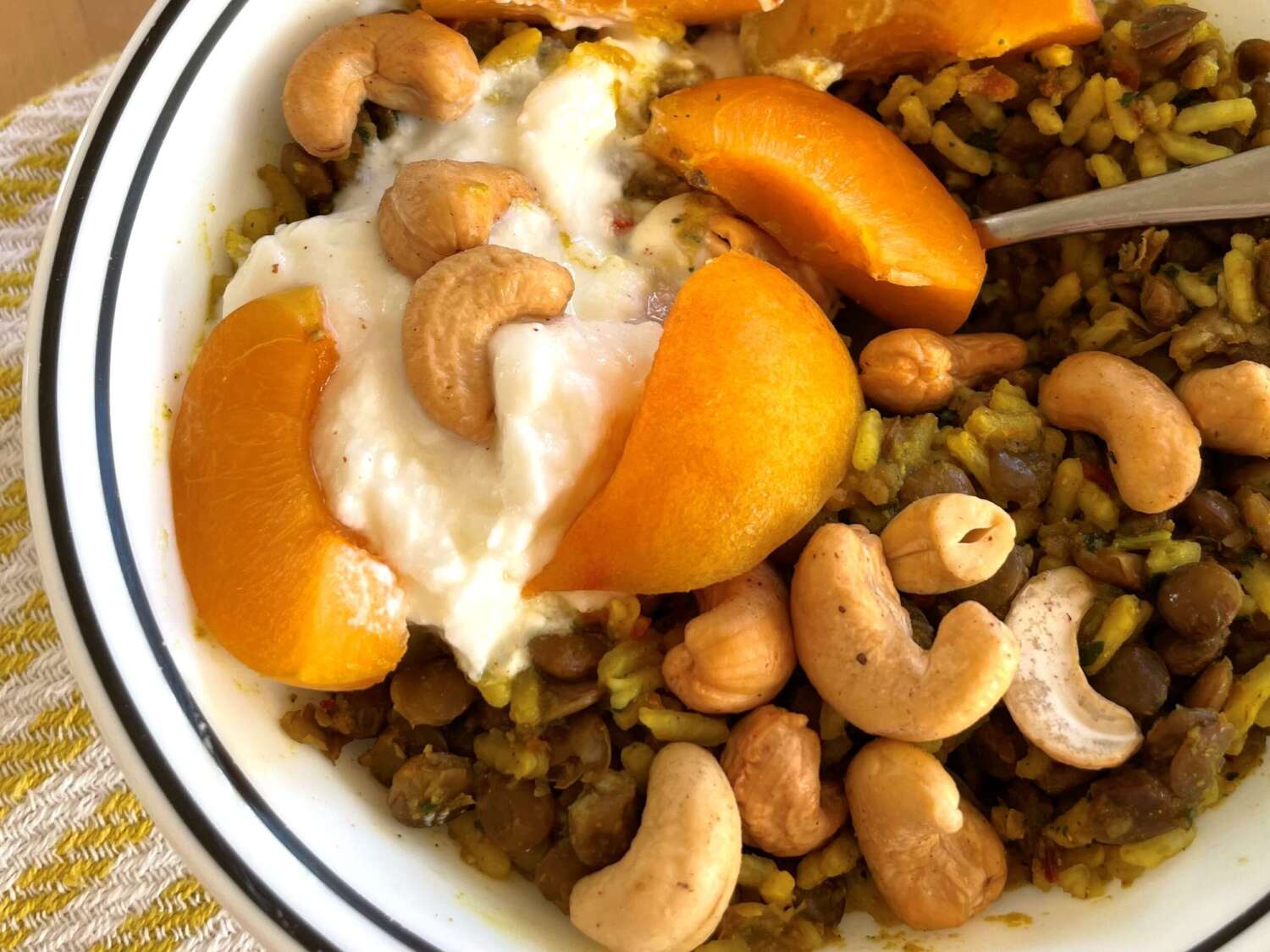 Yumbini Curried Turmeric quick Lentils and Rice is delicous with many types of fruit: apricots, raisins, mango, plums, apples, pears.