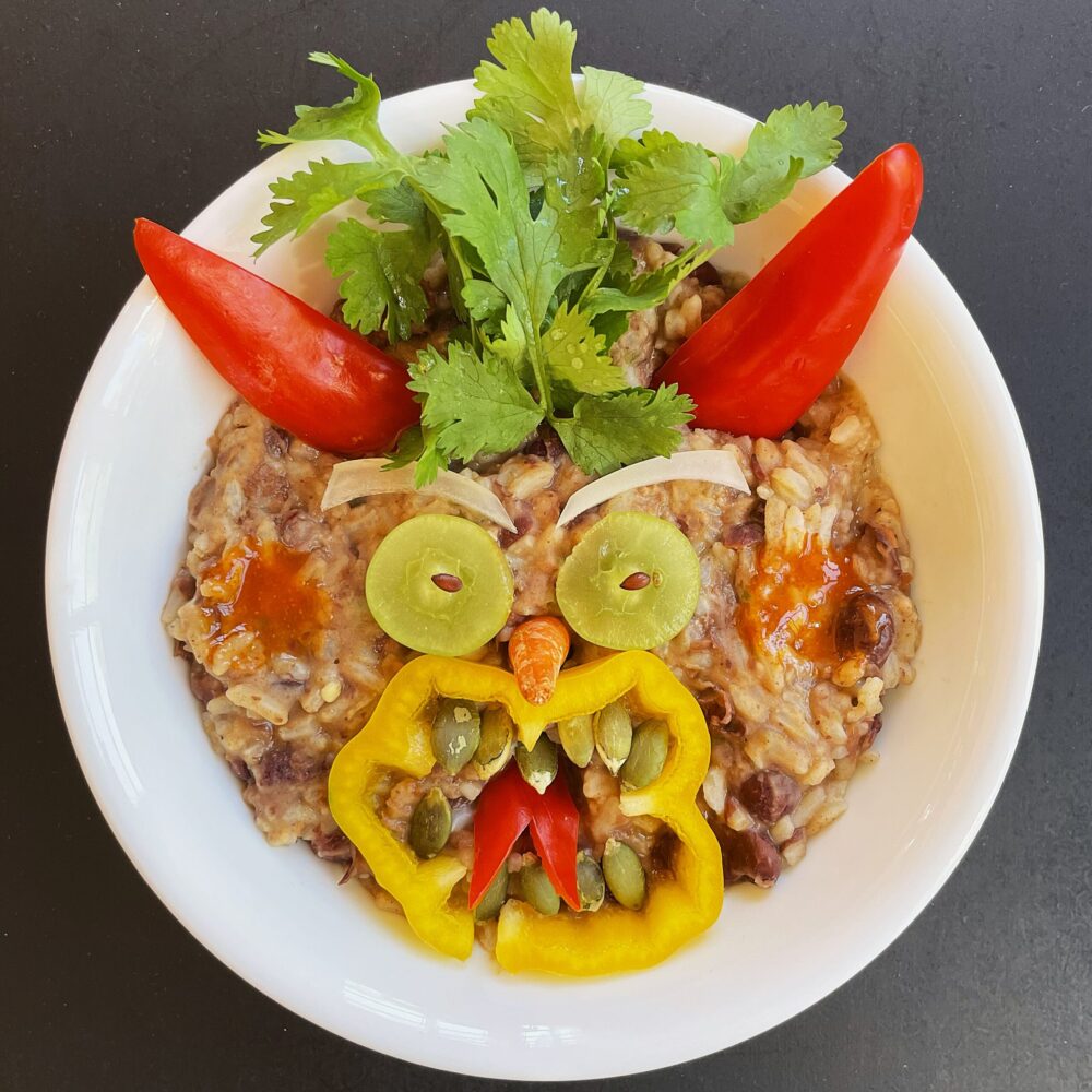 Make Yumbini quick beans and rice extra fun for kids by decorating with fruits and vegetables.